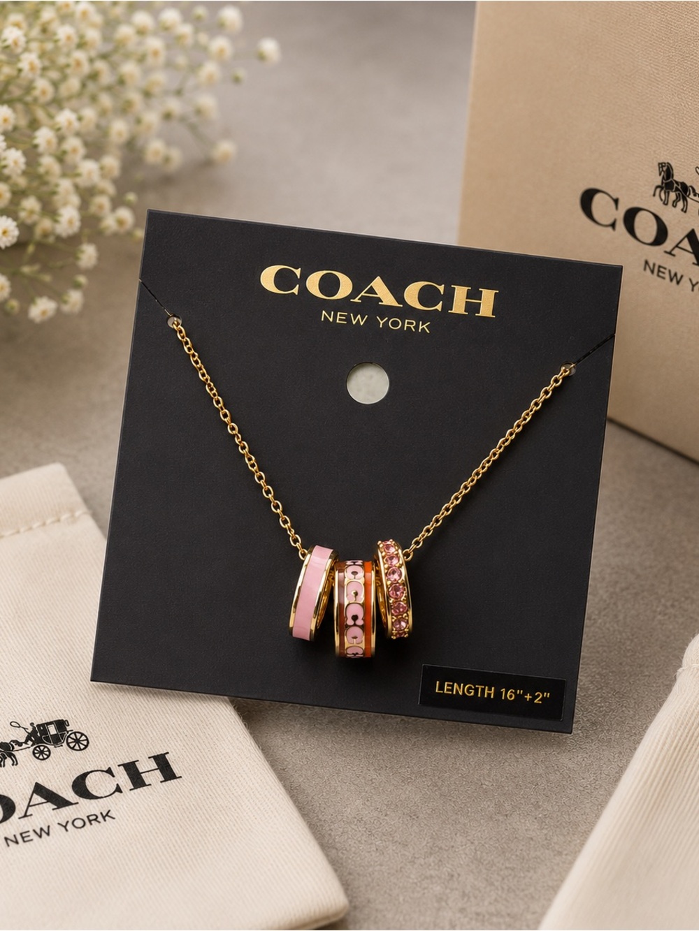 COACH Gold Chain Necklace with Pink Enamel and Crystal Ring Charms